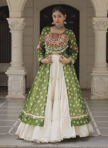 Looking These Navratri Special Lehenga Kurti in Fine Colored. These Lehenga Are Kora Cotton And Kurti Are Fabricated On Faux Georgette Fabriced. It is Beautified With Designer Bandhani Printed With Traditional Kutchi Patch Work.
