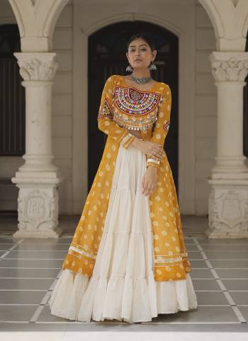 Looking These Navratri Special Lehenga Kurti in Fine Colored. These Lehenga Are Kora Cotton And Kurti Are Fabricated On Faux Georgette Fabriced. It is Beautified With Designer Bandhani Printed With Traditional Kutchi Patch Work.