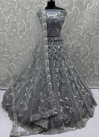 For A Fancy Designer Look,Grab These Lehenga Choli With Dupatta in Fine Colored.These Lehenga And Choli Are Net And Dupatta Are Fabricated On Net Pair.Its Beautified With Fancy Designer Dori,Rainbow Sequance Embroidery With Zarkan Work. 