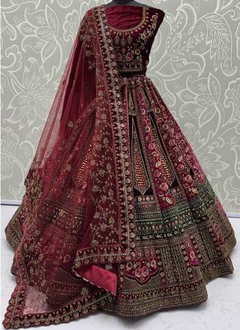 For A Fancy Designer Look,Grab These Lehenga Choli With 2 Dupatta in Fine Colored.These Lehenga And Choli Are Velvet And Dupatta Are Fabricated On Soft Net & Velvet Pair.Its Beautified With Designer Sequance,Mirrar,Dori,Multy Thread Embroidery With Zarkan Diamond Work. 