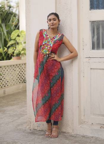 Garb These Beautiful Looking Readymade Navratri Kurti.These Kurti is Fabricated On Georgette.Its Beautified With Bandhej Printed Designer With Kutchi Gamthi Mirror Work.