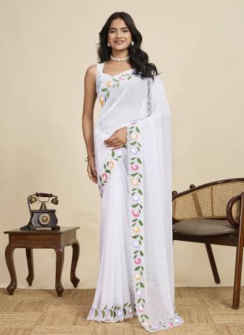 Garb This Party Wear  Saree Paired With Blouse.This Saree And Blouse Are Georgette Fabricated With Designer Brush Printed With Swarovski Work. Buy This Pretty Saree Now.
