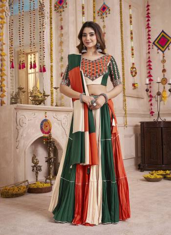 Garb These Navratri Special Lehenga Choli in Fine Colored.These Lehenga Are Viscose Cotton And Blouse Are Viscose Cotton And Dupatta Are Fabricated On Viscose Cotton.Its Beautified With Designer Kutchi Patch,Mirror Work.