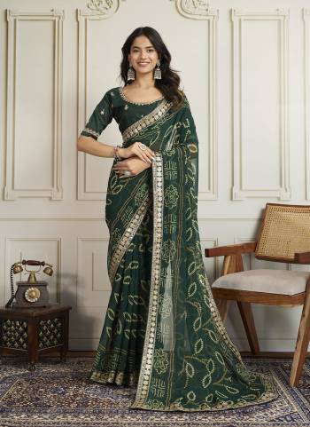 Attrective These Party Wear Saree in Fine Colored.These Saree Are Georgette And Blouse is Art Silk Fabricated.Its Beautified With Bandhani Printed With Embroidery Work Lace Border And Blouse.