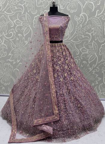 For A Fancy Designer Look,Grab These Lehenga Choli With Dupatta in Fine Colored.These Lehenga And Choli Are Net And Dupatta Are Fabricated On Net Pair.Its Beautified With  Multy Thread, Sequance,Jari Embroidery,Zarkan Work. 