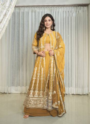 Attrective These Party Wear Skirt Suit in Fine Colored Pair With Bottom And Dupatta.These Top Are Georgette And Dupatta Are Fabricated On Georgette Pair With Georgette Bottom.Its Beautified With Designer Heavy Embroidery Work.