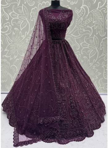 For A Fancy Designer Look,Grab These Lehenga Choli With Dupatta in Fine Colored.These Lehenga And Choli Are Net And Dupatta Are Fabricated On Net Pair.Its Beautified With  Motif,Thread, Sequance Embroidery Work. 