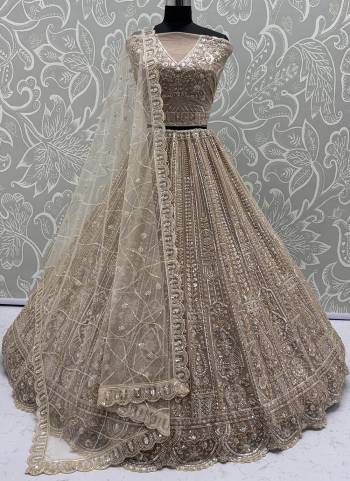 For A Fancy Designer Look,Grab These Lehenga Choli With Dupatta in Fine Colored.These Lehenga And Choli Are Net And Dupatta Are Fabricated On Net Pair.Its Beautified With  Motif,Thread, Sequance Embroidery Work. 