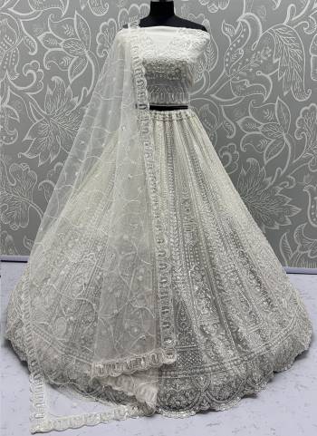 For A Fancy Designer Look,Grab These Lehenga Choli With Dupatta in Fine Colored.These Lehenga And Choli Are Net And Dupatta Are Fabricated On Net Pair.Its Beautified With  Motif,Thread, Sequance Embroidery Work. 