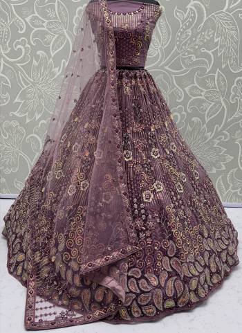 For A Fancy Designer Look,Grab These Lehenga Choli With Dupatta in Fine Colored.These Lehenga And Choli Are Net And Dupatta Are Fabricated On Net Pair.Its Beautified With Multy Thread,Sequance Embroidery,Zarcon Diamond Work. 
