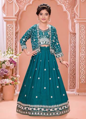 For A Designer Look,Grab These Kidswear Readymade Lehenga Choli Wih Koti in Fine Colored.These Lehenga And Choli Are Fabricated On Soft Silk Pair With Soft Silk Koti.Its Beautified With Designer Thread,Sequance Embroidery Work.