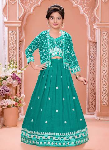 For A Designer Look,Grab These Kidswear Readymade Lehenga Choli Wih Koti in Fine Colored.These Lehenga And Choli Are Fabricated On Soft Silk Pair With Soft Silk Koti.Its Beautified With Designer Thread,Sequance Embroidery Work.