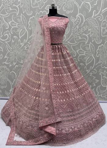 For A Fancy Designer Look,Grab These Lehenga Choli With Dupatta in Fine Colored.These Lehenga And Choli Are Net And Dupatta Are Fabricated On Soft Net Pair.Its Beautified With Dori, Sequance,Jari Embroidery,Zarkon Diamond Work. 