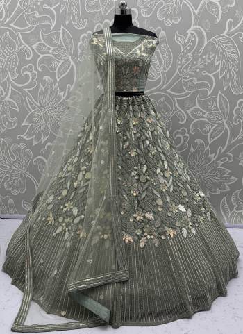 For A Fancy Designer Look,Grab These Lehenga Choli With Dupatta in Fine Colored.These Lehenga And Choli Are Net And Dupatta Are Fabricated On Soft Net Pair.Its Beautified With Dori, Sequance,Thread Embroidery,Zarkon Diamond Work. 