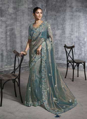 Looking These Fastival Wear Saree in Fine Colored.These Saree Are Tissue Silk And Blouse is Fabricated On Silk.Its Beautified With Designer Mirror,Jari,Sequance Embroidery With Pearl Stone Work.