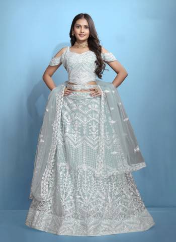 Grab These Beautiful Colored Lehenga Choli.These Lehenga and Dupatta Are Fabricated On Net Pair With Net Blouse.Its Beautified With Designer Thread Embroidery Work.