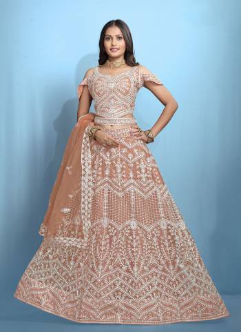 Grab These Beautiful Colored Lehenga Choli.These Lehenga and Dupatta Are Fabricated On Net Pair With Net Blouse.Its Beautified With Designer Thread Embroidery Work.