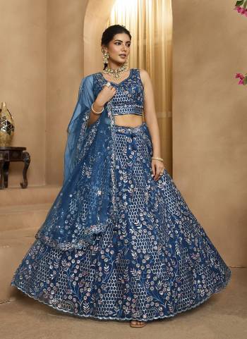 Garb This Party Wear Fine Color Fancy Heavy Designer Choli And Lahenga Fabriced On Net And Dupatta Net In Fabricated Beautified With Attrective Designer Heavy Sequance,Multy Thread  Embroidery Work. Buy Now.