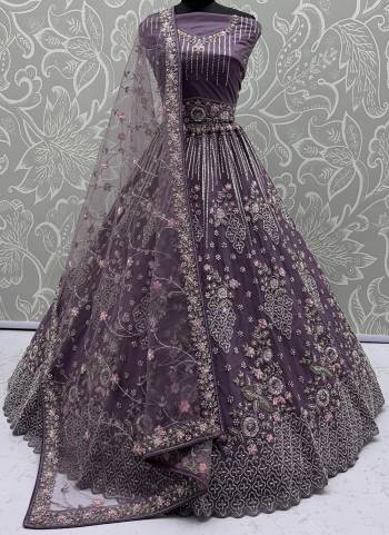 For A Fancy Designer Look,Grab These Lehenga Choli With Dupatta in Fine Colored.These Lehenga And Choli Are Net And Dupatta Are Fabricated On Soft Net Pair.Its Beautified With Heavy Flower Multy Cotton Thread,Silver Dori, Sequance Embroidery,Zarkon Diamond With Crystal Pipi Hand Work. 