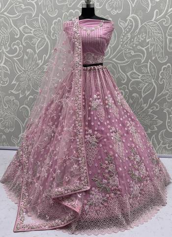 For A Fancy Designer Look,Grab These Lehenga Choli With Dupatta in Fine Colored.These Lehenga And Choli Are Net And Dupatta Are Fabricated On Soft Net Pair.Its Beautified With Heavy Flower Multy Cotton Thread,Silver Dori, Sequance Embroidery,Zarkon Diamond With Crystal Pipi Hand Work. 
