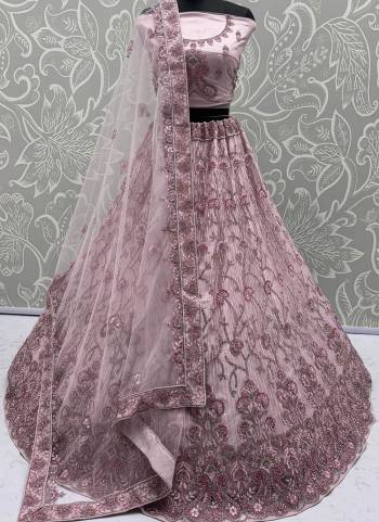 For A Fancy Designer Look,Grab These Lehenga Choli With Dupatta in Fine Colored.These Lehenga And Choli Are Net And Dupatta Are Fabricated On Soft Net Pair.Its Beautified With Heavy Dori, Sequance,Jari Embroidery,Zarkon Diamond Work. 