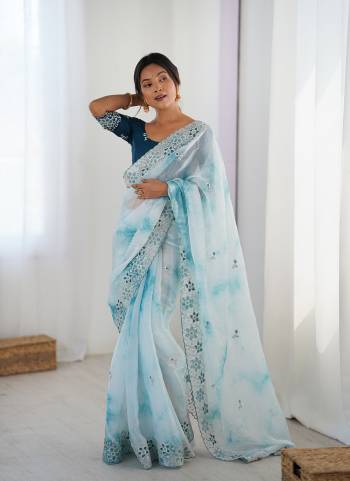 Garb These Party Wear Saree in Fine Colored.These Saree Are Fendy And Blouse is Malai Silk Fabricated.Its Beautified With Badal Printed Designer With Sequance,Coding Embroidery Work.
