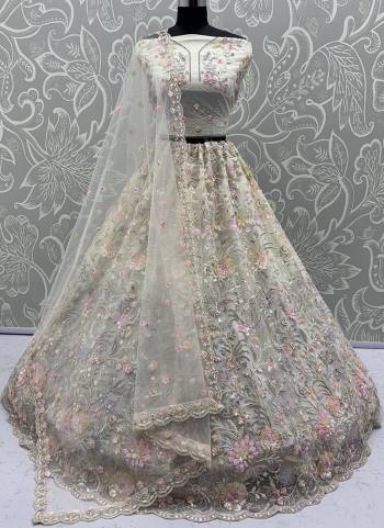 For A Fancy Designer Look,Grab These Lehenga Choli With Dupatta in Fine Colored.These Lehenga And Choli Are Net And Dupatta Are Fabricated On Soft Net Pair.Its Beautified With Heavy Multy Thread,Dori,Sequance Embroidery,Zarkon Diamond Work. 
