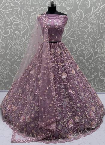 For A Fancy Designer Look,Grab These Lehenga Choli With Dupatta in Fine Colored.These Lehenga And Choli Are Net And Dupatta Are Fabricated On Soft Net Pair.Its Beautified With Heavy Multy Thread,Dori,Sequance Embroidery,Zarkon Diamond Work. 