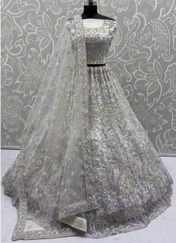 For A Fancy Designer Look,Grab These Lehenga Choli With Dupatta in Fine Colored.These Lehenga And Choli Are Net And Dupatta Are Fabricated On Soft Net Pair.Its Beautified With Heavy Multy Thread,Dori,Sequance Embroidery,Zarkon Diamond Work. 