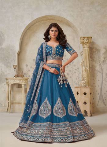 For A Designer Look,Grab These Lehenga Choli in Fine Colored.These Lehenga And Choli Are Fabricated On Silk Pair With Soft Net Dupatta.Its Beautified With Designer Embroidery,Hand Work.