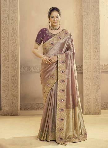 Look Attractive These Designer Party Wear Fancy Saree in Fine Colored.These Saree Are Matallic Jari Tissue Silk And Blouse Matallic Jari Tissue Silk is Fabricated.Its Beautified Fancy Traditional Motifs,Cutdana Hand Work.