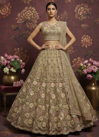 For A Fancy Designer Look,Grab These Lehenga Choli With Dupatta in Fine Colored.These Lehenga And Choli Are Net And Dupatta Are Fabricated On Soft Net Pair.Its Beautified With Heavy Sober Color Sequance,Jari,Dori Embroidery,Modif Crystal Pipe Hand Work. 