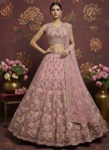 For A Fancy Designer Look,Grab These Lehenga Choli With Dupatta in Fine Colored.These Lehenga And Choli Are Net And Dupatta Are Fabricated On Soft Net Pair.Its Beautified With Heavy Sober Color Sequance,Jari,Dori Embroidery,Modif Crystal Pipe Hand Work. 