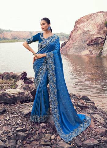 Attrective This Party wear Saree Paired With Blouse.This Saree Are Satin Jacquard Silk And Blouse Are Satin Silk Based Fabric With Weaving Jari Designer With Sequance,Jari,Thread Embroidery,Beads,Stone,Tassels Work. Buy This Pretty Saree Now.