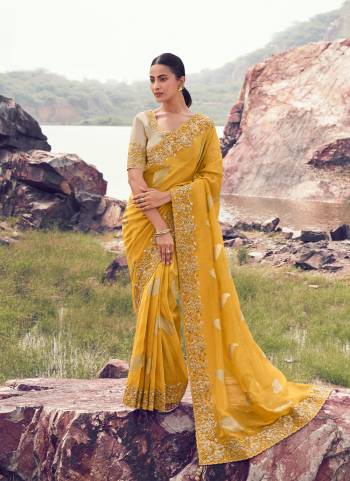 Attrective This Party wear Saree Paired With Blouse.This Saree Are Tissue Jacquard Silk And Blouse Are Tissue Silk Based Fabric With Weaving Jari Designer With Sequance,Jari,Thread Embroidery,Beads,Stone,Tassels Work. Buy This Pretty Saree Now.