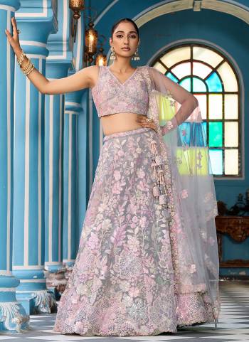 Attrective Looking This Party Wear Fine Color Fancy Heavy Designer Choli And Lahenga Fabriced On Net And Dupatta Net In Fabricated Beautified With Attrective Designer Sequance Embroidery Work. Buy Now.