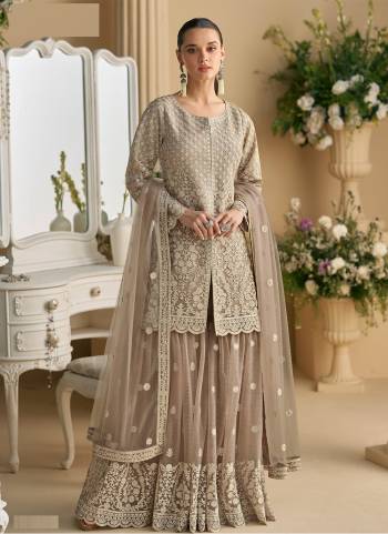 Attractive These Party Wear Free Size Stitched Plazzo Suit in Fine Colored Pair With Dupatta.These Top And Dupatta Are Net And Bottom Are Crepe Silk And Pair With Santoon Inner.Its Beautified With Heavy Designer Embroidery Work.
