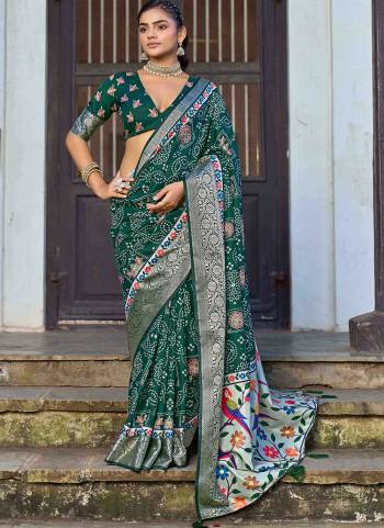 Looking These Traditinol Party Wear Saree in Fine Colored.These Saree Are Silk And Blouse is Fabricated On Silk Pair.Its Beautified With Woven Designer,Bandhani Ajrakh Printed.