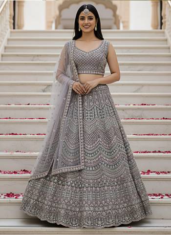 For A Fancy Designer Look,Grab These Lehenga Choli With Dupatta in Fine Colored.These Lehenga And Choli Are Net And Dupatta Are Fabricated On Soft Net Pair.Its Beautified With Heavy Designer Sequance,Dori Embroidery,Modif Crystal Pipe,Beads Hand Work. 