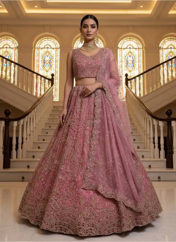 For A Fancy Designer Look,Grab These Lehenga Choli With Dupatta in Fine Colored.These Lehenga And Choli Are Net And Dupatta Are Fabricated On Soft Net Pair.Its Beautified With Heavy White Pearl Beads,Thread,Jari,Dori Embroidery,Zircon Diamond Work. 