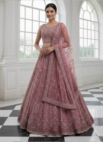 For A Fancy Designer Look,Grab These Lehenga Choli With Dupatta in Fine Colored.These Lehenga And Choli Are Net And Dupatta Are Fabricated On Soft Net Pair.Its Beautified With Heavy Multy Thread,Sequance,Dori Embroidery,Zircon Diamond Work. 