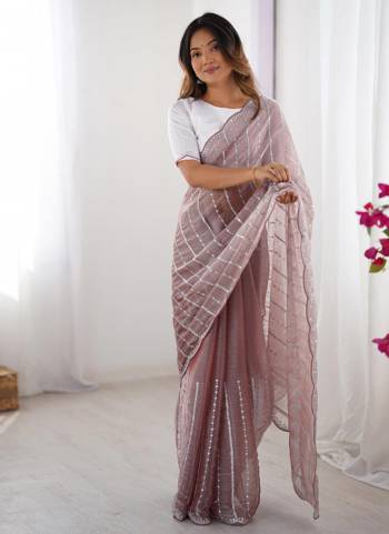 Looking These Party Wear Saree in Fine Colored.These Saree Are Zimmy Choo And Blouse is Fabricated On Mono Banglori.Its Beautified With Fancy Designer Embroidery Work.