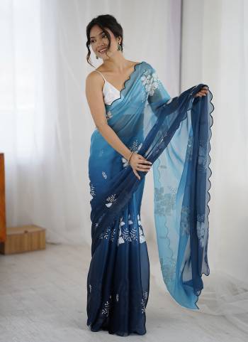 Garb These Party Wear Saree in Fine Dual Shaded Colored.These Saree Are Jimmy Choo And Blouse is Satin Silk Fabricated.Its Beautified With Pedding Color Printed With Designer Sequance Embroidery Work.