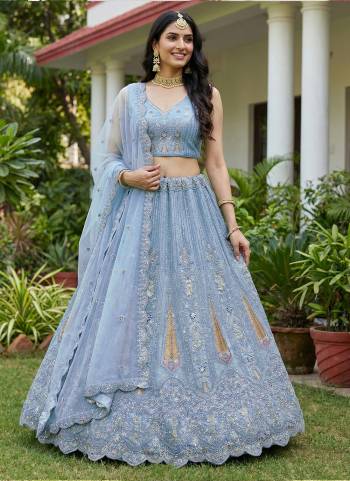 For A Fancy Designer Look,Grab These Lehenga Choli With Dupatta in Fine Colored.These Lehenga And Choli Are Bridal Net And Dupatta Are Fabricated On Soft Net Pair.Its Beautified With Fancy Dori, Sequance,Multy Thread,Jari Embroidery,Zarcon Diamond Work. 