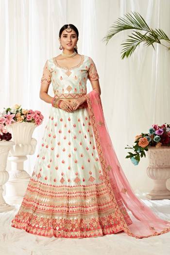 Heavy Designer Lehenga Choli In White and Baby Pink Color Fabricated On Net Beautified With Heavy Attractive Embroidery. 