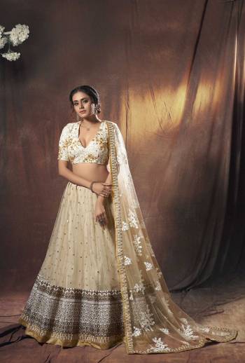 Heavy Designer Lehenga Choli In Light Fancy Color Fabricated On Soft Net Beautified With Heavy Attractive Embroidery. Buye Now.