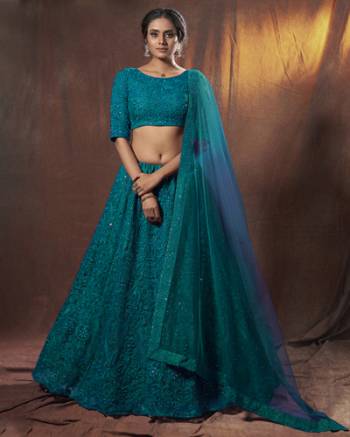 Heavy Designer Lehenga Choli In Light Fancy Color Fabricated On Soft Net Beautified With Heavy Attractive Embroidery. Buye Now.