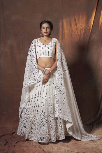 Heavy Designer Lehenga Choli In Light Fancy Color Fabricated On Soft Net Beautified With Heavy Attractive Embroidery. Buye Now.