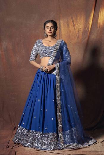 Heavy Designer Lehenga Choli In Light Fancy Color Fabricated On Soft Net Beautified With Heavy Attractive Embroidery. Buye Now.