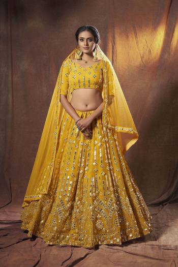 Heavy Designer Lehenga Choli In Light Fancy Color Fabricated On Soft Net Beautified With Heavy Attractive Embroidery. Buye Now.